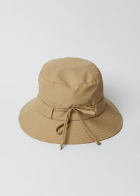Back of camel brown water resistant bucket hat
