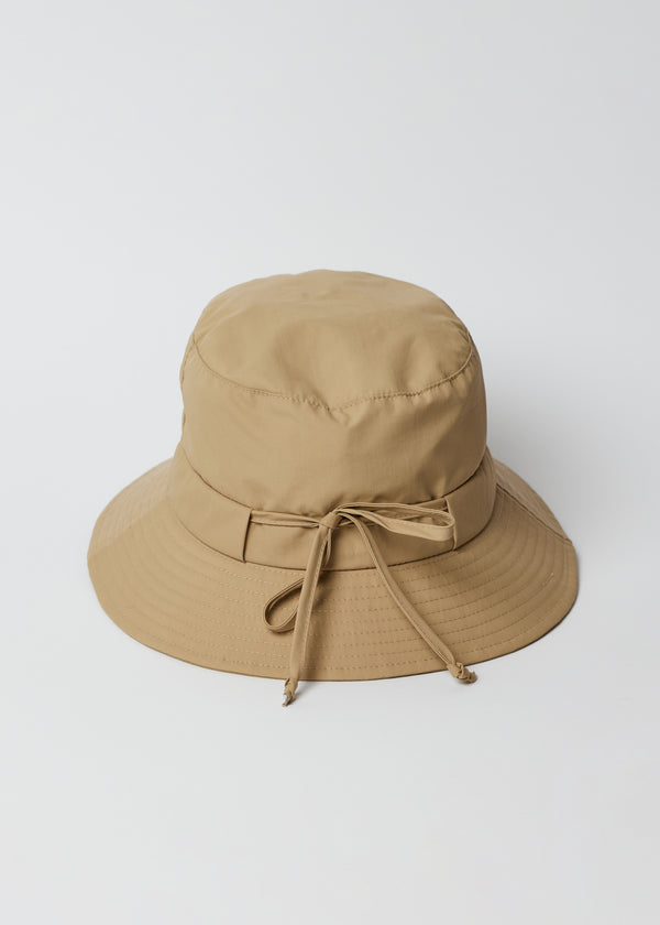 Back of camel brown water resistant bucket hat