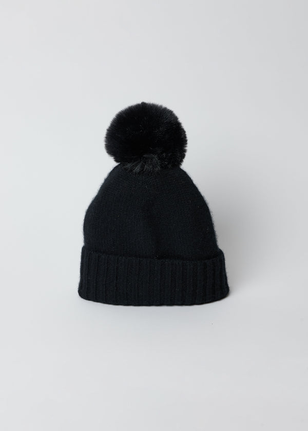 Black cashmere slouchy cuffed beanie with faux fur pom