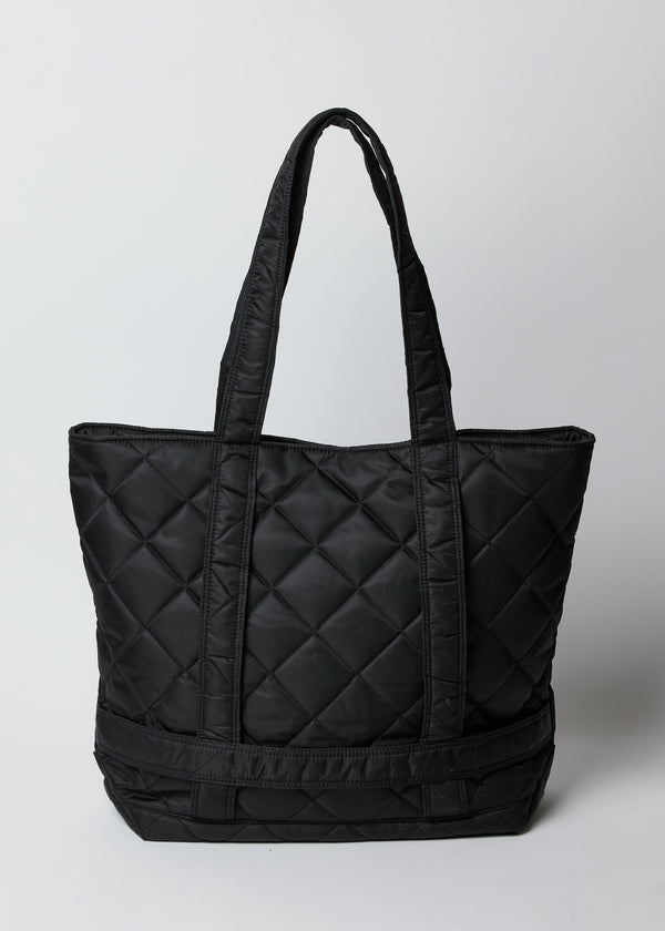 Black quilted nylon bag with straps to hold a hat