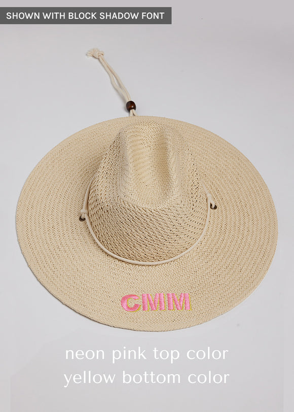 Surfer style sun hat with pink and yellow embroidered letters and chinstrap