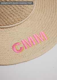 Close up of surfer style sun hat with embroidered letters