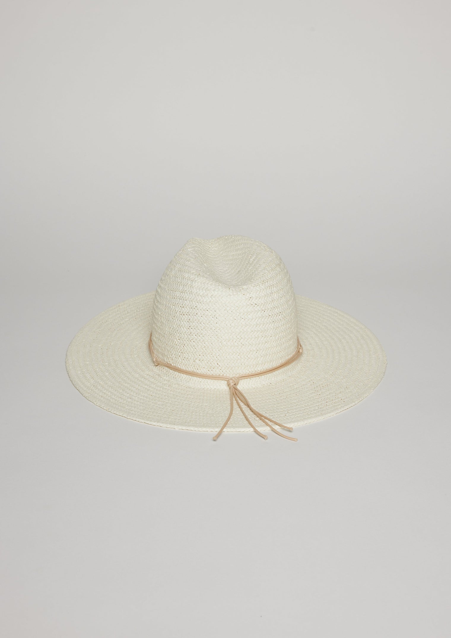 Back of white sun hat with tan tie detail