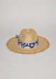 Straw hat with fringe detail on brim and blue floral fabric trim