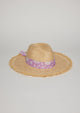 Straw hat with fringe detail on brim and lavender floral fabric trim