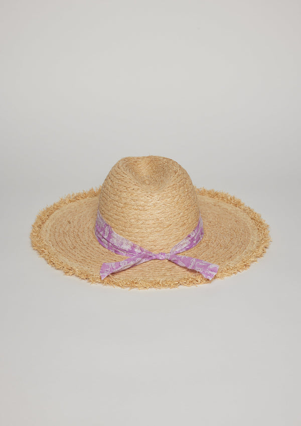 Back view of straw hat with fringe detail on brim and lavender floral fabric trim