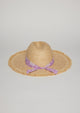Back view of straw hat with fringe detail on brim and lavender floral fabric trim