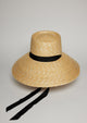 Large brimmed straw hat with black ribbon tie