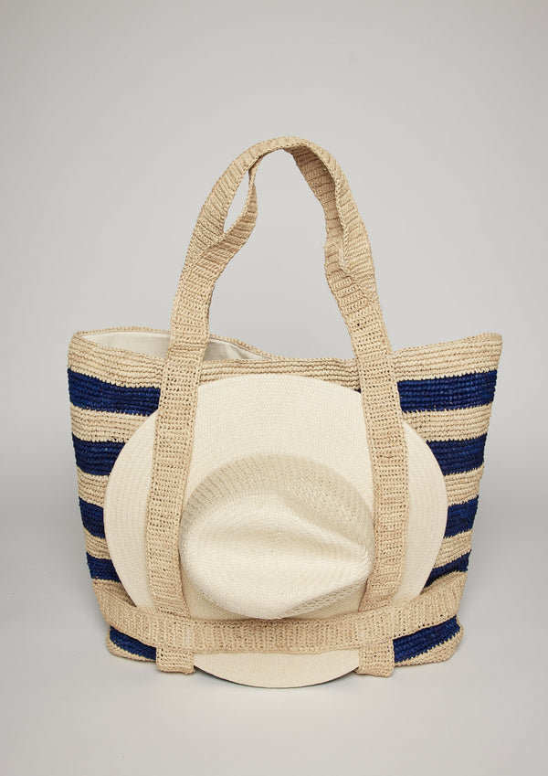 Navy striped straw tote with white hat attached with straps