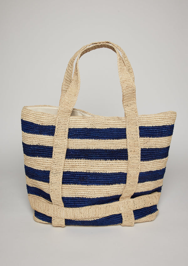 Navy striped straw tote bag with straps to show where a hat will be attached 