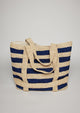 Navy striped straw tote bag with handles and straps where hat will be attached