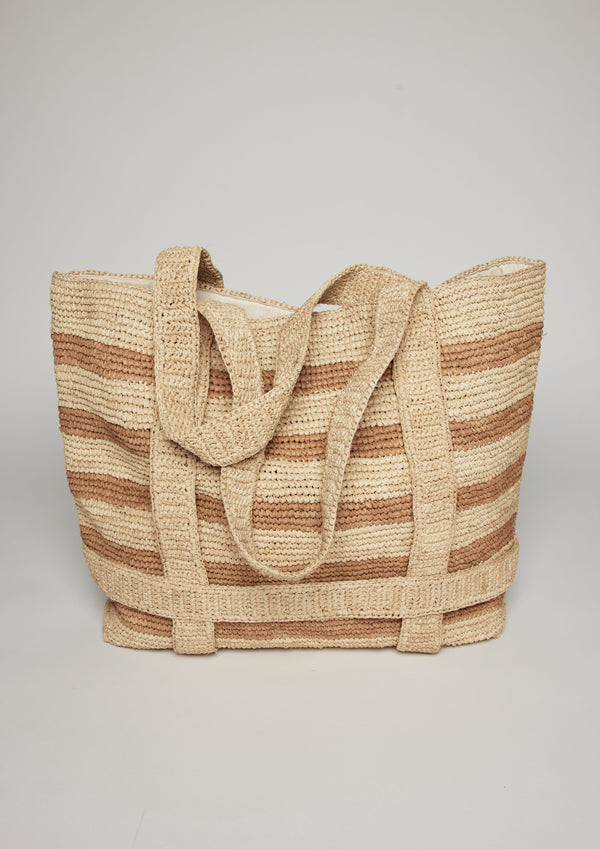 Tan striped straw tote with straps for hat to be attached