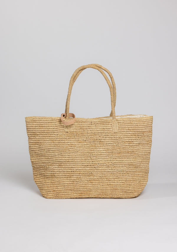 Large straw beach tote with hat loop