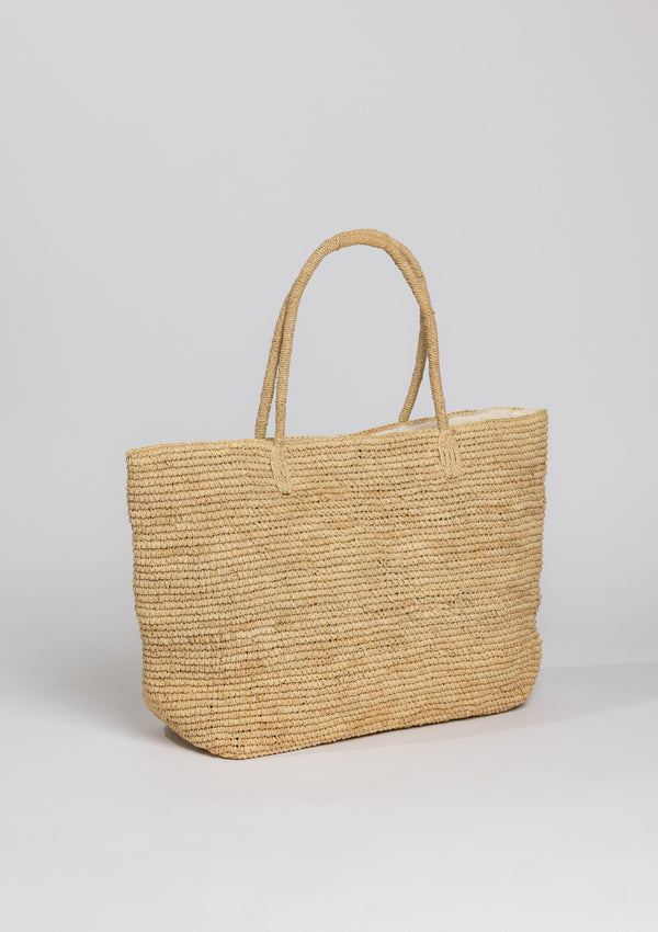 Large straw beach tote on angle