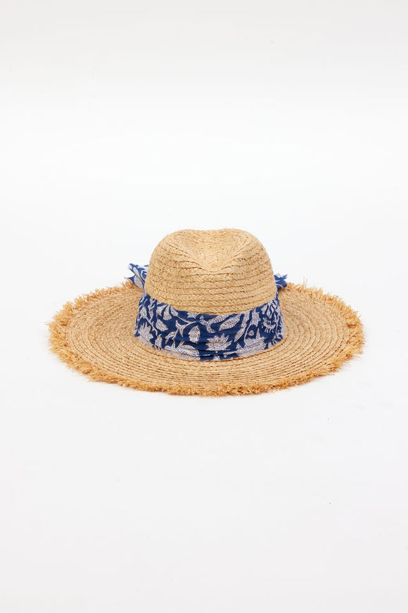 front of braided raffia sunhat with royal blue floral trim