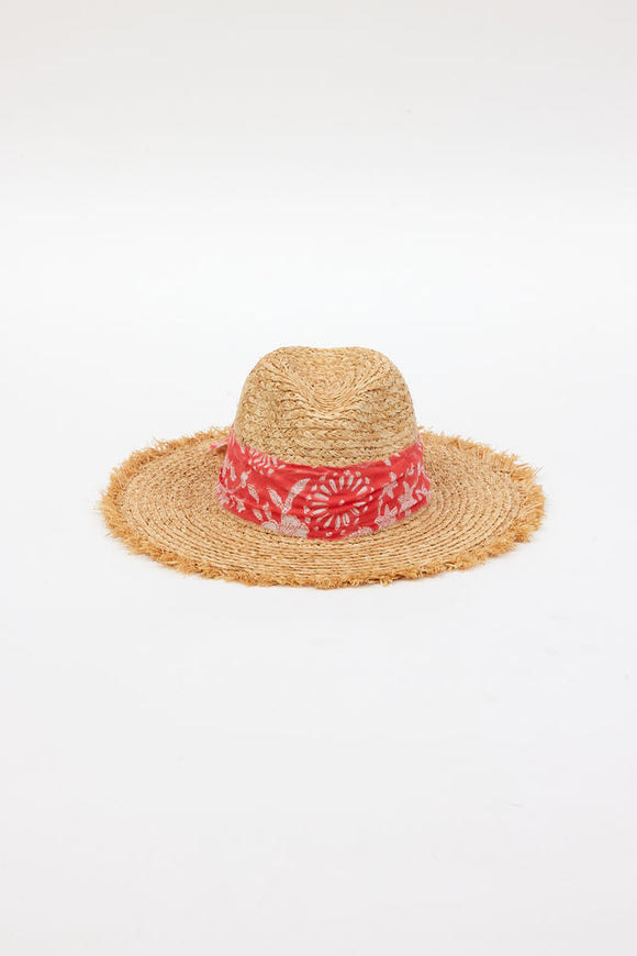 front of braided raffia sunhat with coral floral trim