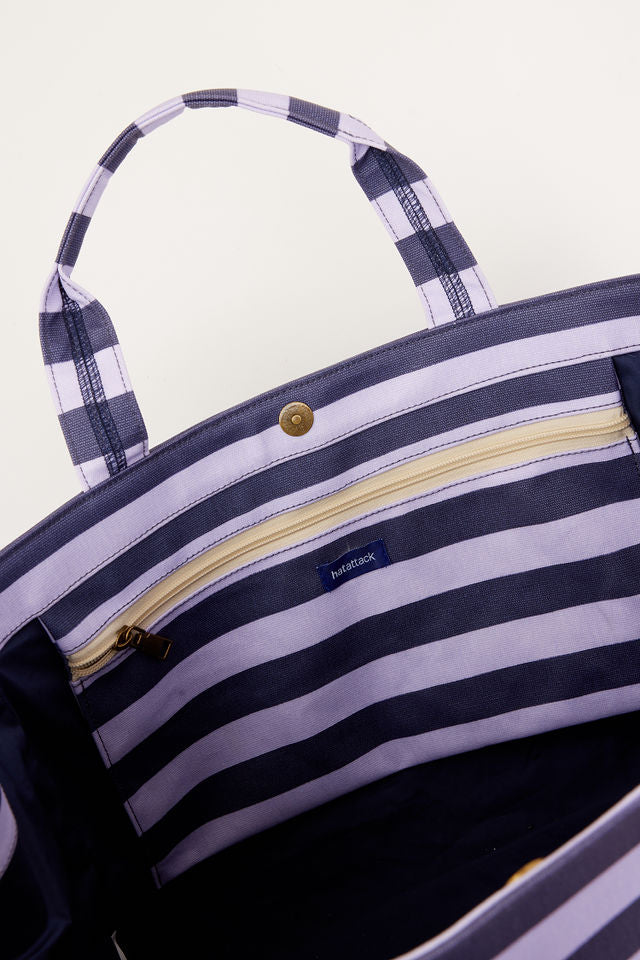inside of blue and lavender striped bag