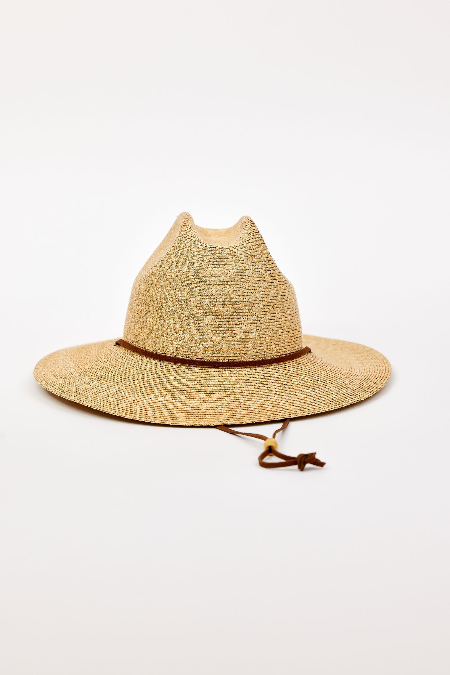 Beige straw hat with a brown band and chinstrap on a white background