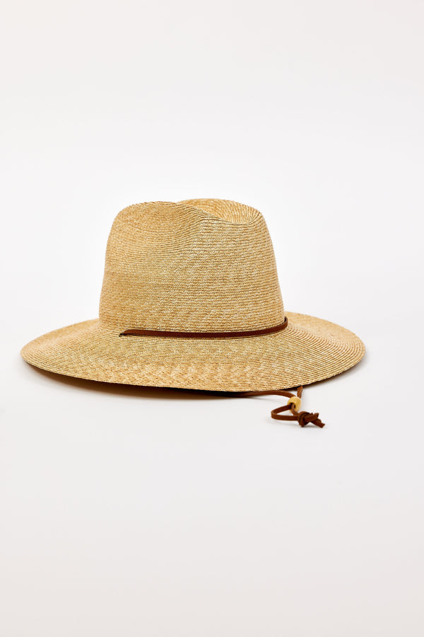 Beige straw hat with a wide brim and chinstrap on a white background