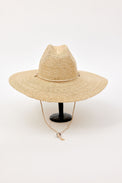 Beige straw hat on a white background
