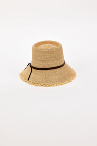Beige straw bucket hat with a black band on a white background