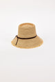 Beige straw bucket hat with a black band on a white background