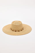Beige straw hat with a wide brim and decorative beads on a white background