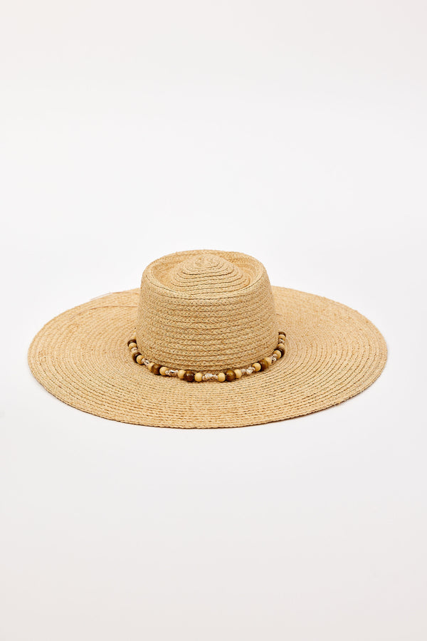 Beige straw hat with a wide brim and decorative beads on a white background