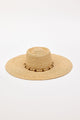 Beige straw hat with a wide brim and decorative beads on a white background