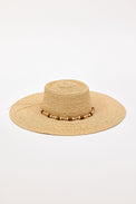 Beige straw hat with a wide brim and beaded trim detail on a white background
