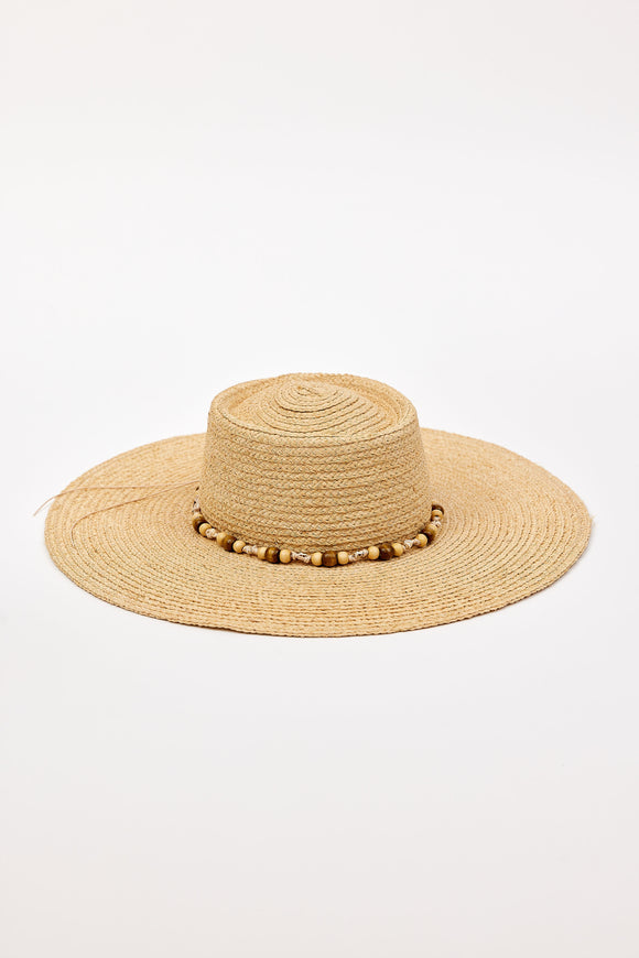 Beige straw hat with a wide brim and beaded trim detail on a white background
