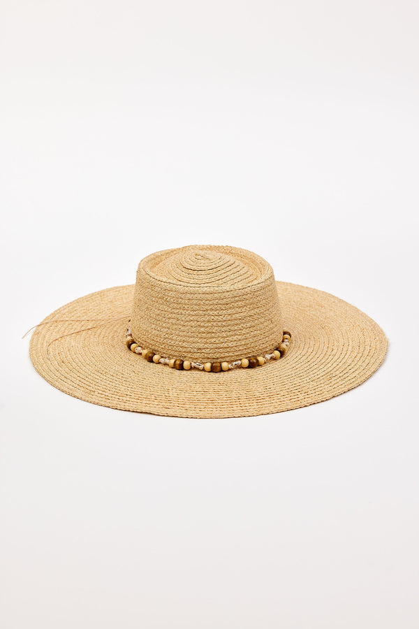 Beige straw hat with a wide brim and beaded trim detail on a white background