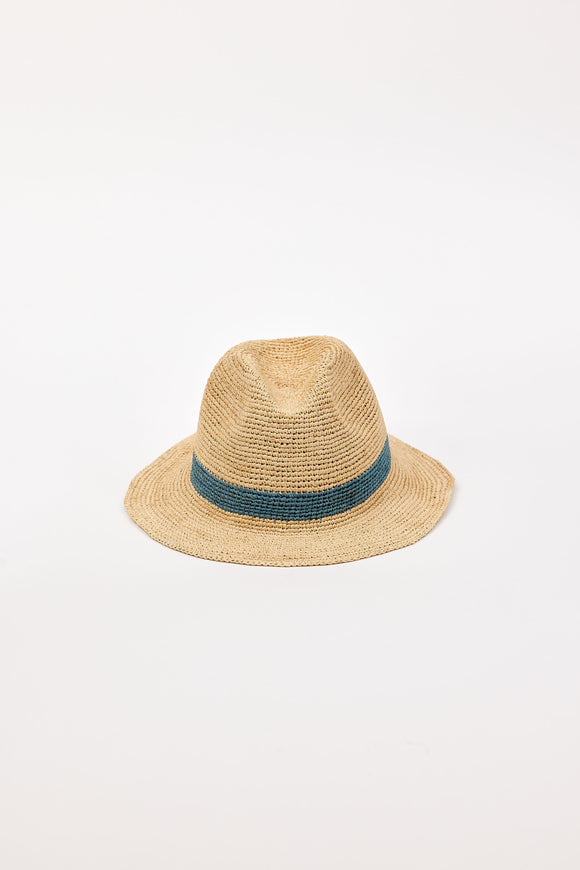 Straw hat with a blue band on a light beige background