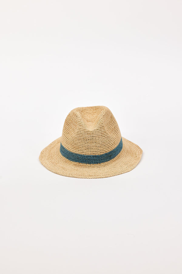 Straw hat with a blue band on a light beige background