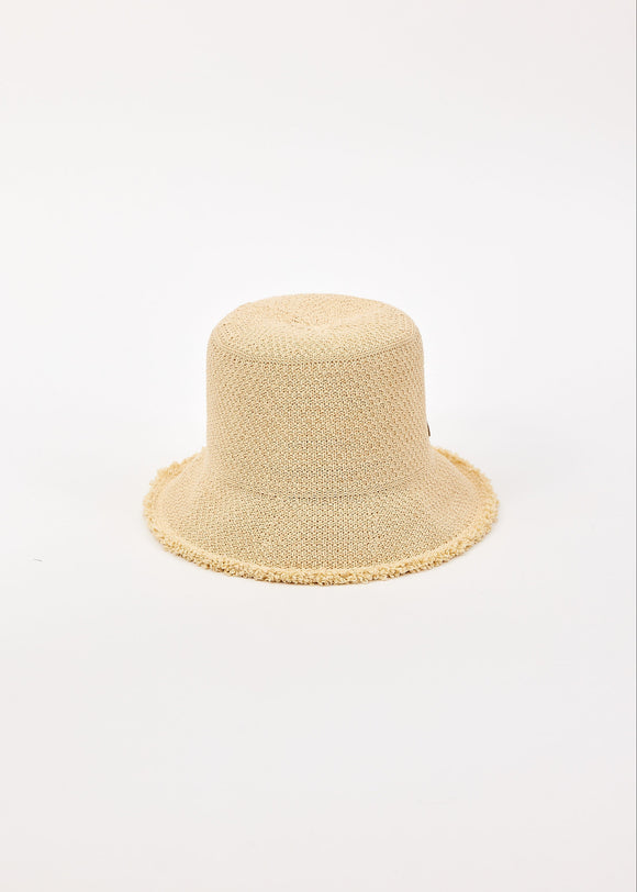 Beige woven bucket hat on a light beige background