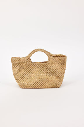 Tan woven straw handbag on a white background
