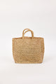 Woven bag with handles on a white background