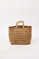 Two toned woven bag with handles on a white background