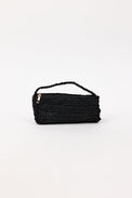 Black woven handbag on a white background