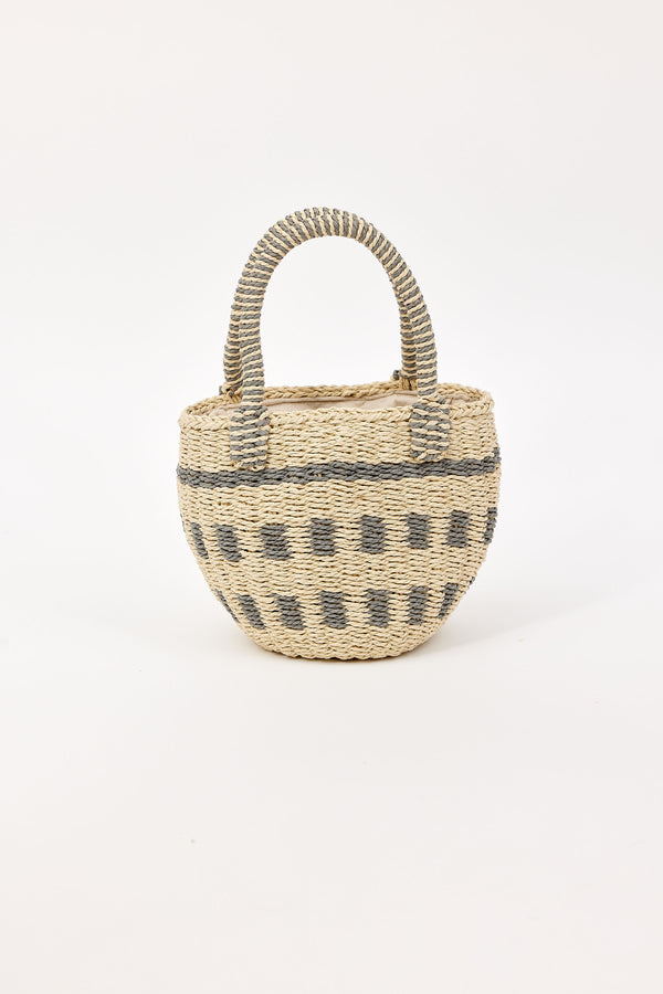 Woven tan and silver bag with handles on a white background