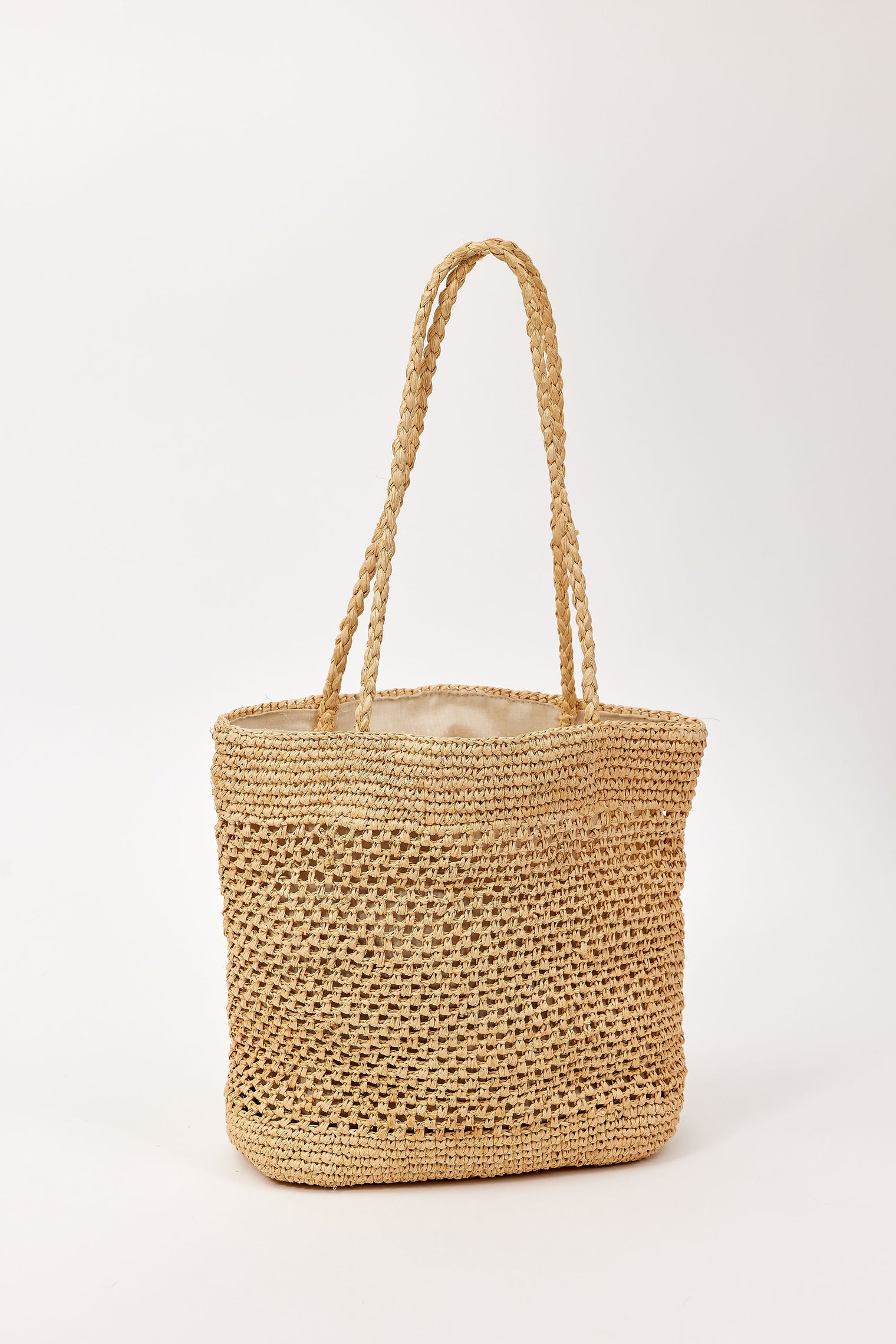 Woven straw bag on a white background