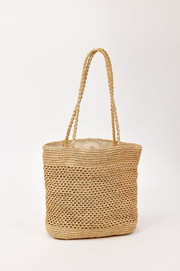 Woven straw bag on a white background