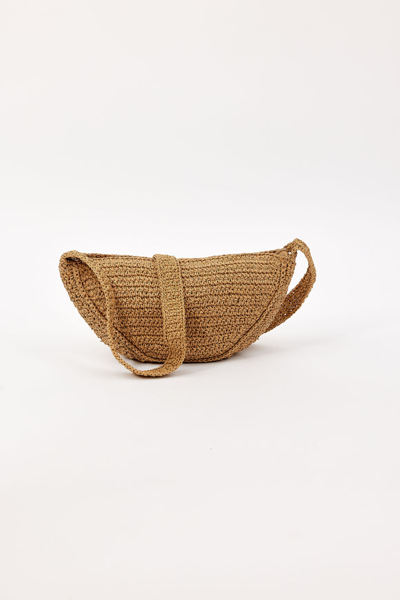Woven crossbody handbag on a white background