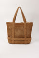 Brown straw bag with straps to hold a hat