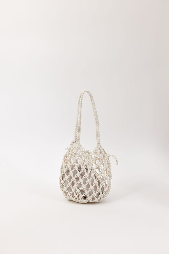 Open weave handbag with a handle on a white background