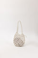 Open weave handbag with a handle on a white background