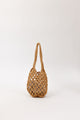Brown open weave handbag on a white background