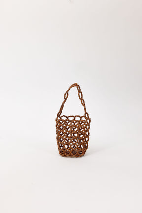Brown beaded handbag on a white background