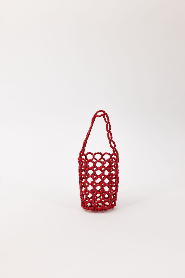 Red beaded handbag on a white background