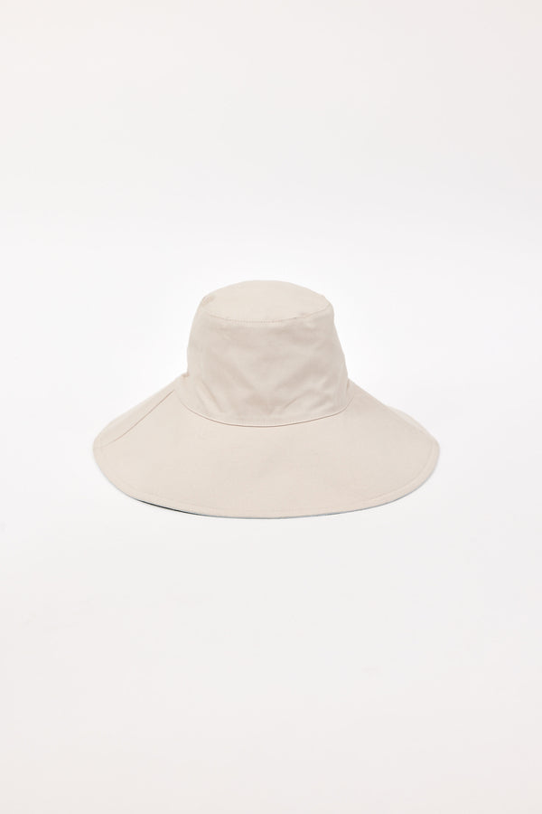 Beige wide-brimmed bucket hat on a white background